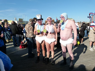 a group of people wearing diapers and a hat