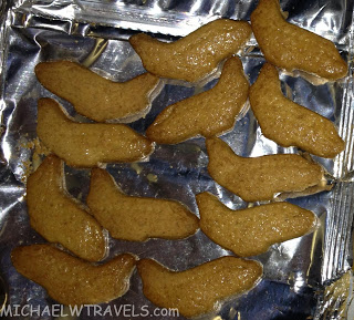 a group of brown food on a foil