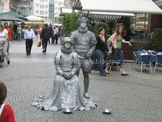 a statue of a man and a woman in a garment
