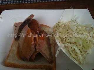 a sandwich and coleslaw on a plate