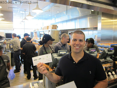 a man holding a check in a restaurant