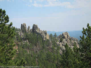 a rocky mountain with trees