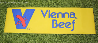 a yellow sign with blue text