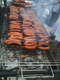 a group of sausages on a grill