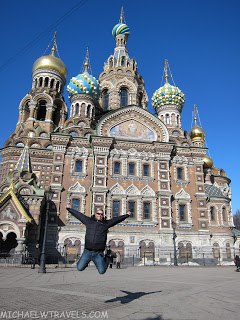 a man jumping in front of Church of the Savior on Blood