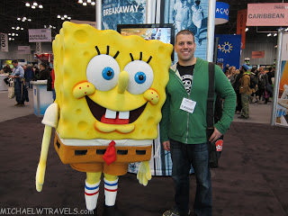 a man standing next to a character