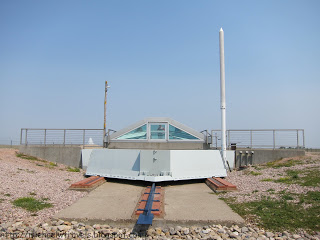 a metal structure with a metal roof