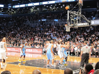 a basketball game with a crowd watching