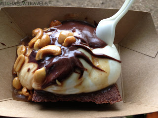 a brownie with chocolate and cashews