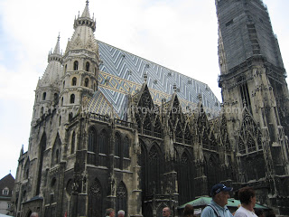 a large building with many spires with St. Stephen's Cathedral, Vienna in the background