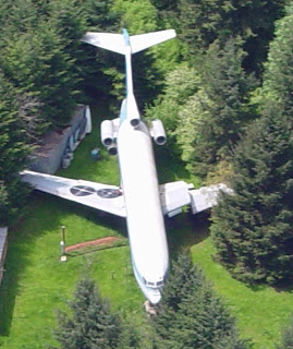 an airplane parked in a yard