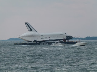 a space shuttle on a floating platform