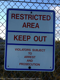 a sign on a fence