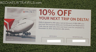 a coupon on a green surface