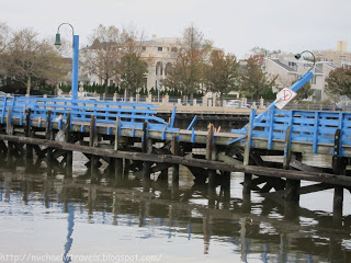 a blue wooden bridge over water
