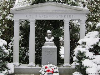 a statue of a child in a cemetery