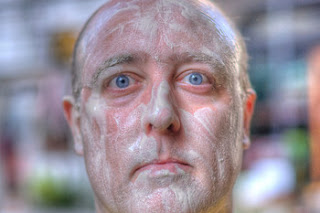 a man with white powder on his face