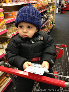 a child in a shopping cart