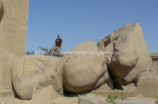 a man standing on a large rock