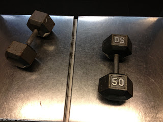 two weights on a metal surface