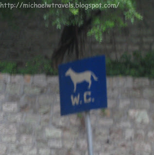 a blue sign with a horse on it