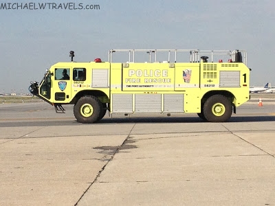 a yellow firetruck on a runway