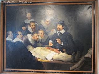 a painting of a man lying on a table
