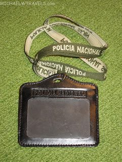 a black badge with a lanyard