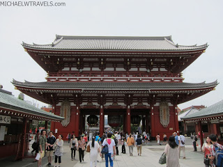 a group of people walking in front of Sensō-ji