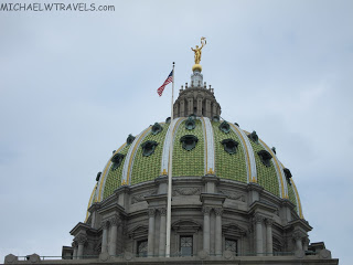 Pennsylvania State Capitol with a flag on top