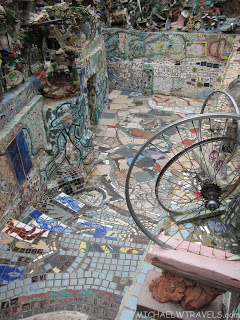 a mosaic floor with a bicycle wheel