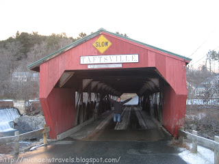 a man standing in a covered bridge